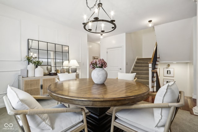 dining space featuring a chandelier and hardwood / wood-style flooring