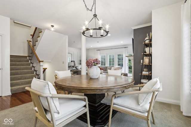 dining area with a chandelier and dark hardwood / wood-style floors