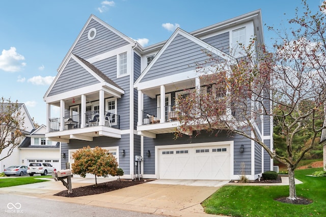 view of front of home with a balcony and a garage