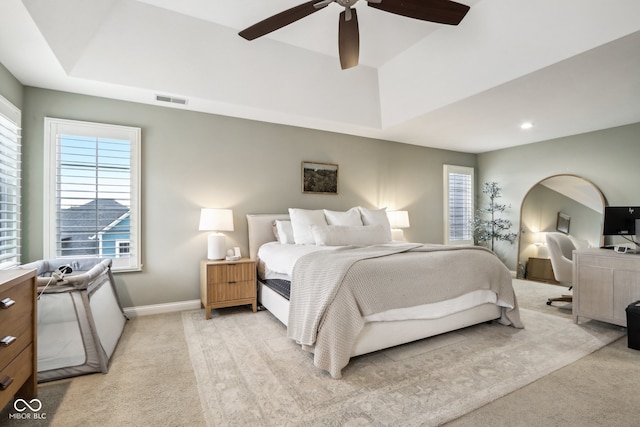 bedroom featuring ceiling fan and light carpet