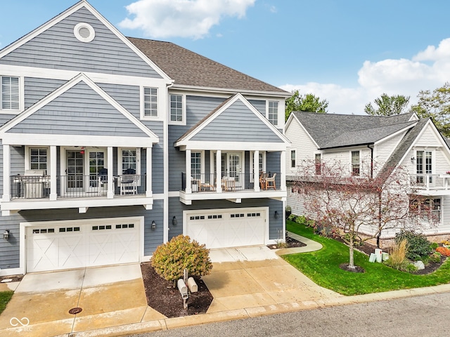 view of front of home featuring a balcony and a garage