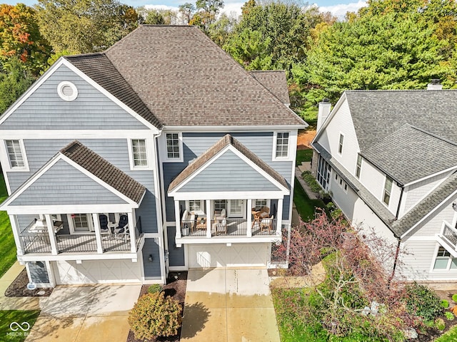 exterior space featuring covered porch and a garage