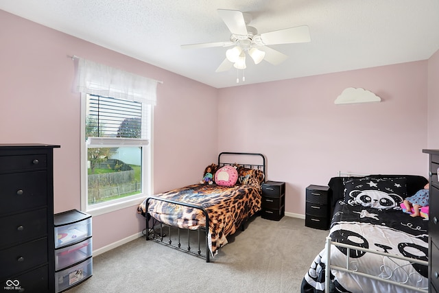 bedroom with light carpet and ceiling fan