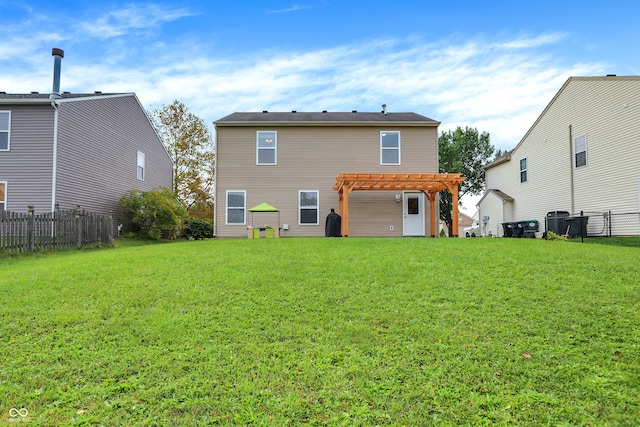 back of property with a lawn and a pergola