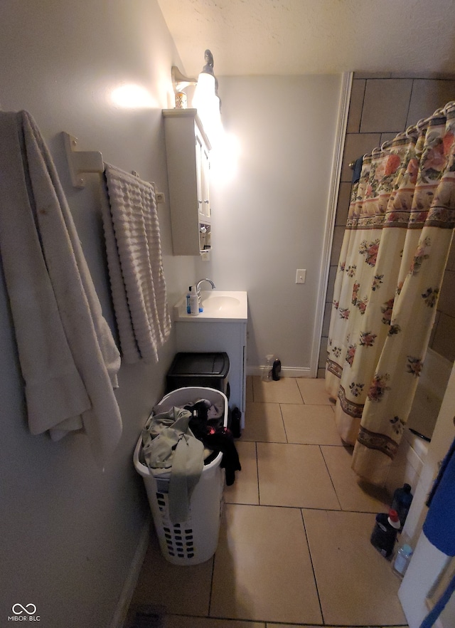 bathroom featuring vanity, a shower with curtain, and tile patterned floors