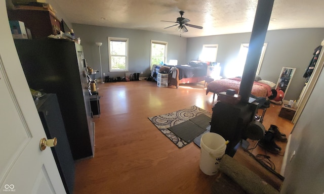 bedroom with hardwood / wood-style flooring and ceiling fan