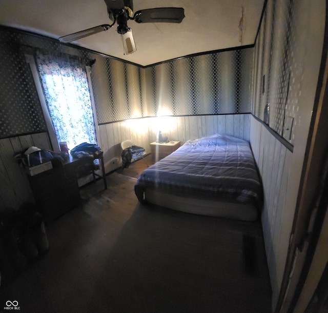 bedroom with hardwood / wood-style floors and ceiling fan