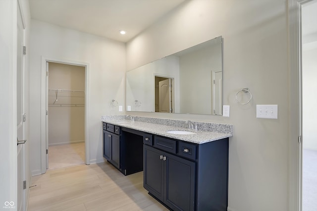 bathroom featuring vanity and hardwood / wood-style flooring