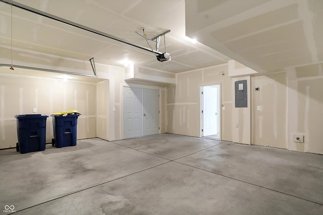 garage with electric panel and a garage door opener