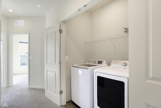 laundry area featuring independent washer and dryer and carpet floors