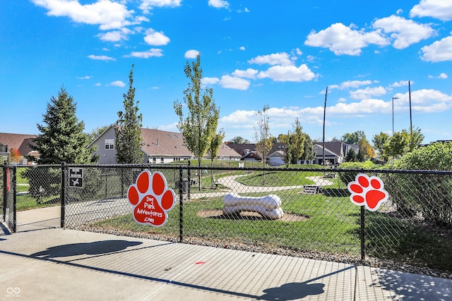 view of property's community featuring a yard