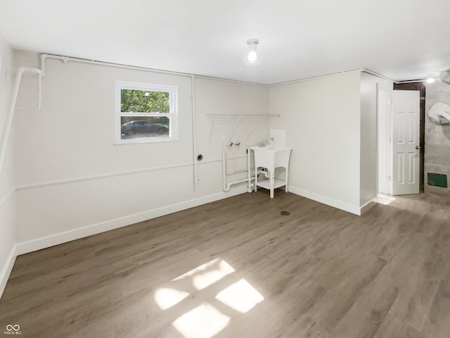 interior space with sink and dark wood-type flooring