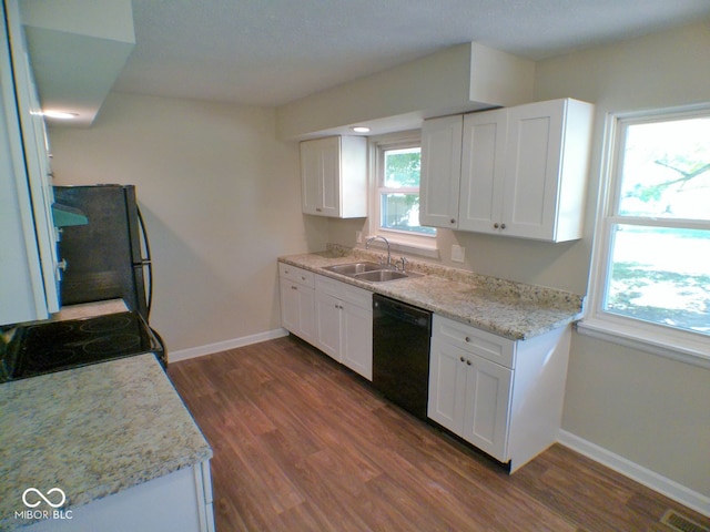 kitchen with sink, black appliances, white cabinets, and dark hardwood / wood-style flooring