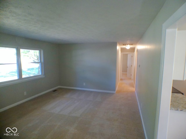 unfurnished room featuring carpet