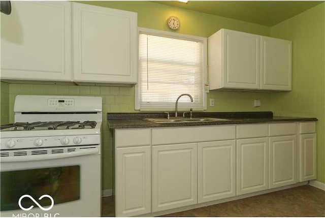 kitchen featuring white cabinetry, sink, and white gas range oven