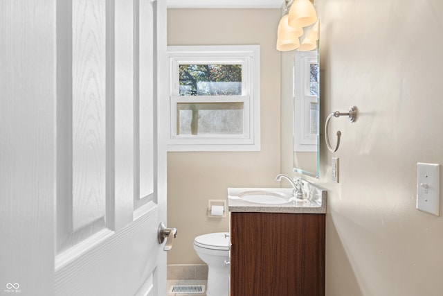 3233 Plum Creek Rd, Nashville, IN 47448 - half bathroom featuring vanity, toilet, and visible vents