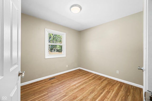 3233 Plum Creek Rd, Nashville, IN 47448 - unfurnished room featuring visible vents, light wood finished floors, and baseboards