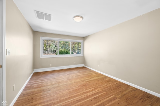 3233 Plum Creek Rd, Nashville, IN 47448 - spare room featuring baseboards, light wood-type flooring, and visible vents