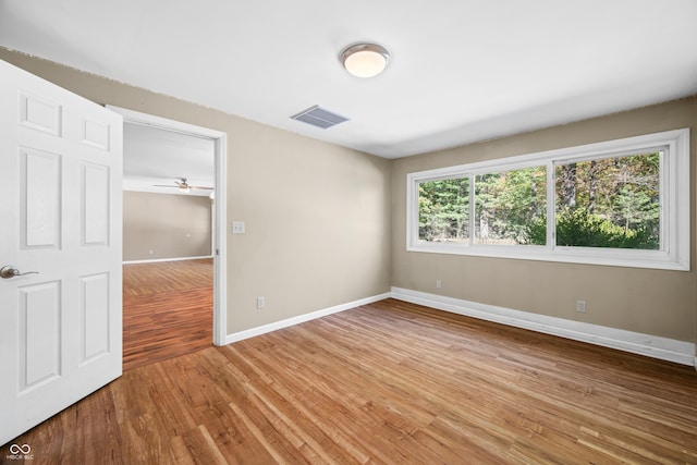 3233 Plum Creek Rd, Nashville, IN 47448 - empty room with a ceiling fan, baseboards, visible vents, and light wood-style floors