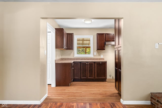 3233 Plum Creek Rd, Nashville, IN 47448 - kitchen with light countertops, light wood finished floors, and dark brown cabinets