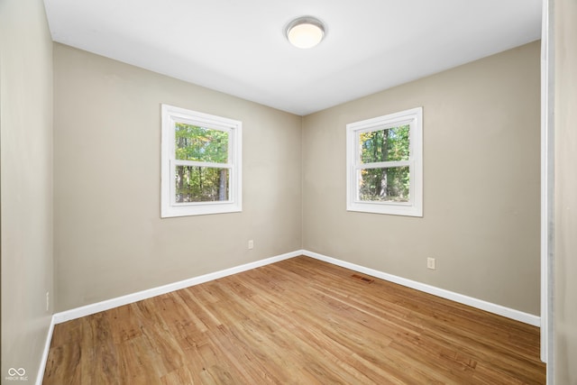 3233 Plum Creek Rd, Nashville, IN 47448 - unfurnished room with baseboards, visible vents, and light wood-style floors