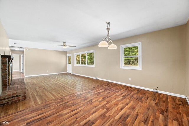 3233 Plum Creek Rd, Nashville, IN 47448 - unfurnished living room featuring baseboards, ceiling fan, and wood finished floors