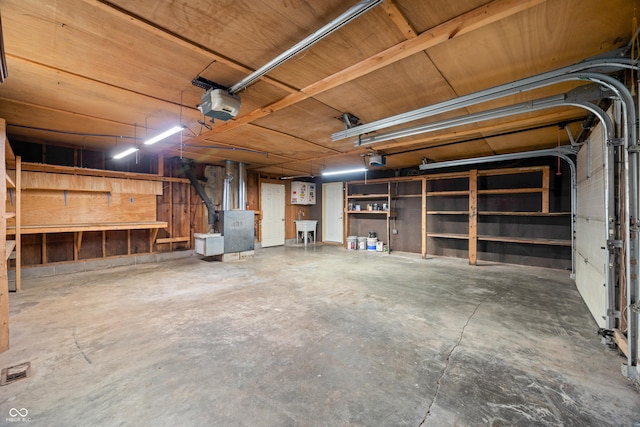 3233 Plum Creek Rd, Nashville, IN 47448 - garage featuring a sink and a garage door opener
