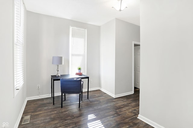 office space with dark hardwood / wood-style flooring