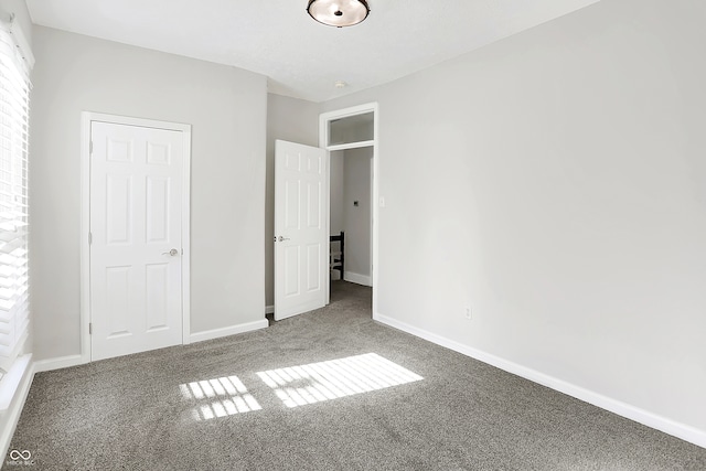 unfurnished bedroom featuring carpet