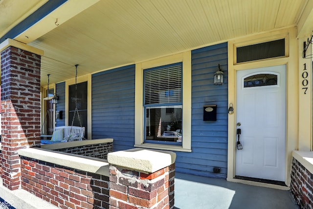 entrance to property with a porch