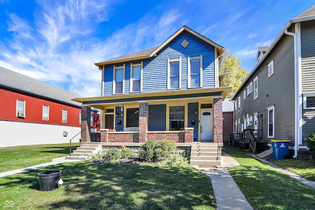 view of front of home featuring a front lawn and covered porch