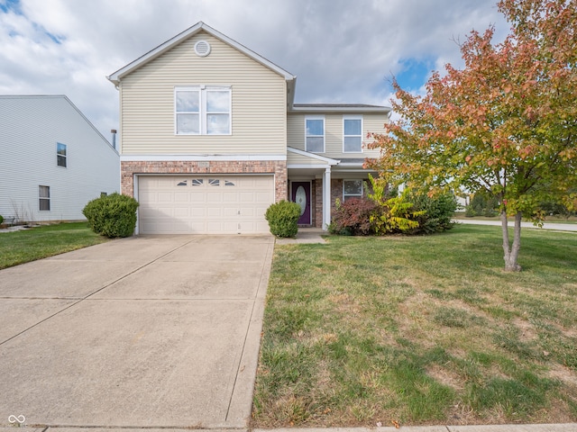 view of front of property with a front lawn and a garage