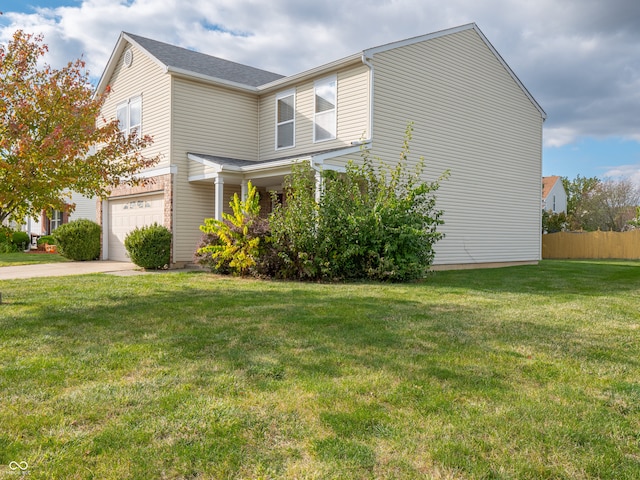 view of home's exterior featuring a yard and a garage