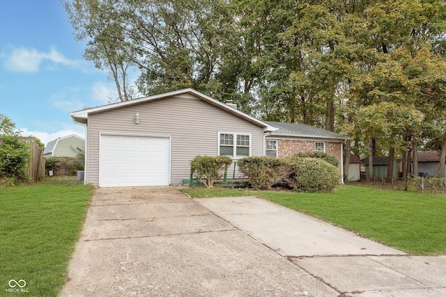 single story home with a garage and a front lawn