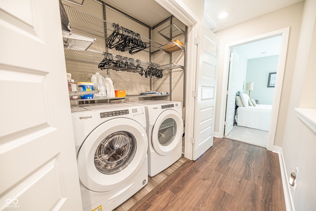 washroom with washer and dryer and dark hardwood / wood-style floors