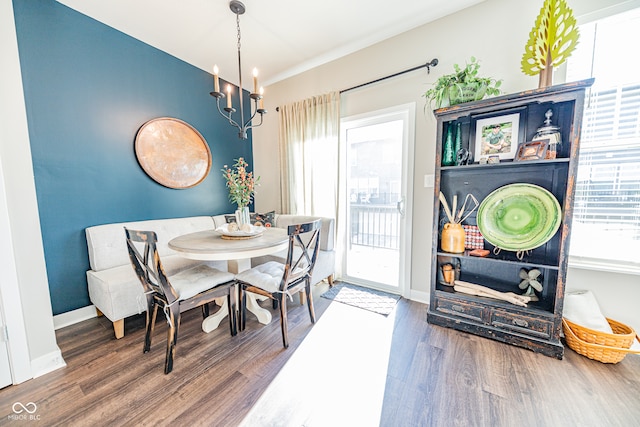 dining room featuring a chandelier and wood-type flooring