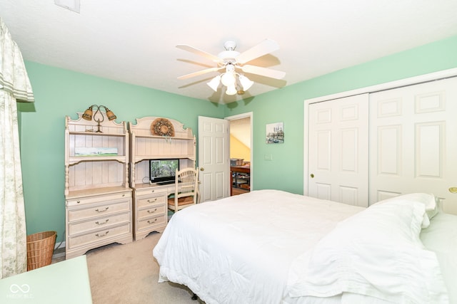 carpeted bedroom with a closet and ceiling fan