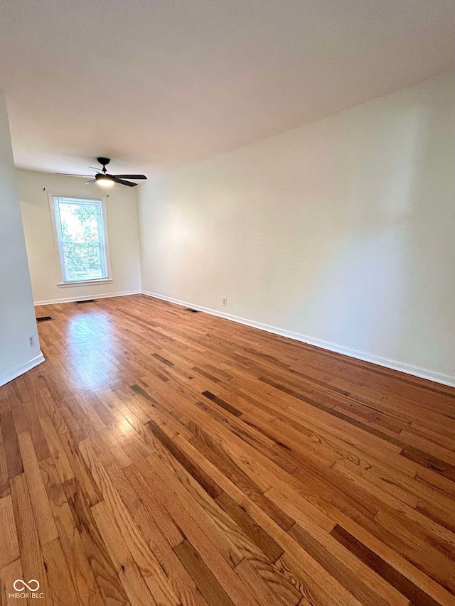 unfurnished room featuring light hardwood / wood-style floors and ceiling fan