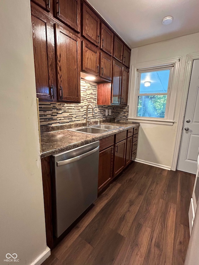 kitchen featuring dishwasher, dark wood-type flooring, dark brown cabinets, sink, and tasteful backsplash