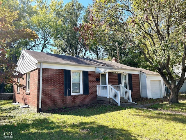 single story home featuring a front lawn and a garage