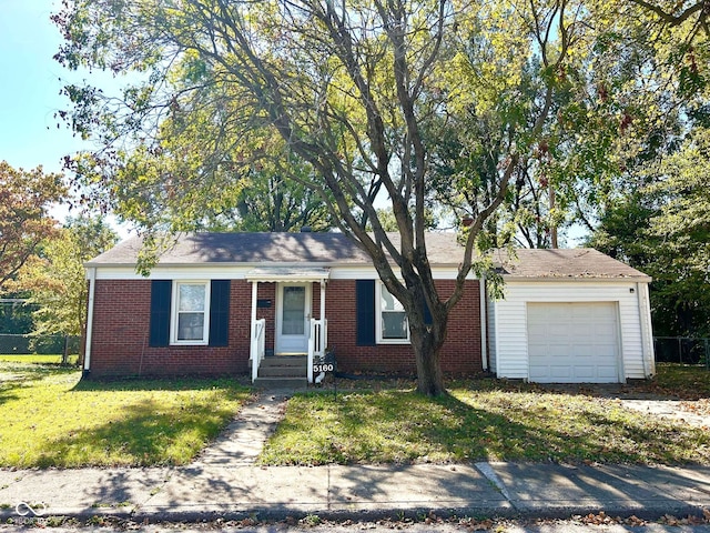 single story home featuring a front yard and a garage