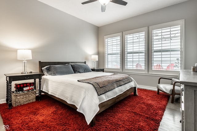 bedroom featuring hardwood / wood-style floors and ceiling fan