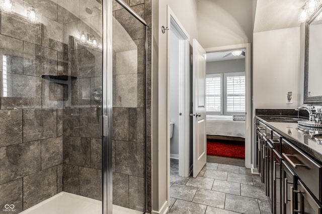 bathroom featuring vanity, tile patterned flooring, and a shower with door