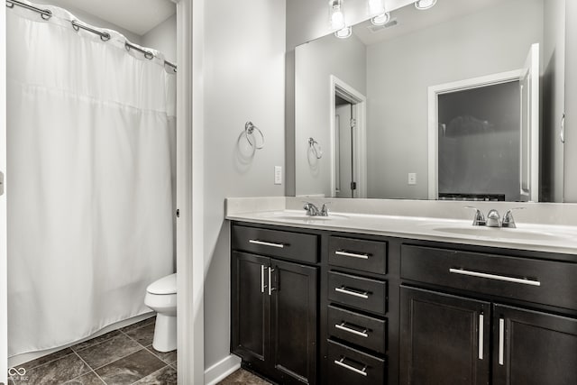 bathroom featuring vanity, a shower with curtain, and toilet