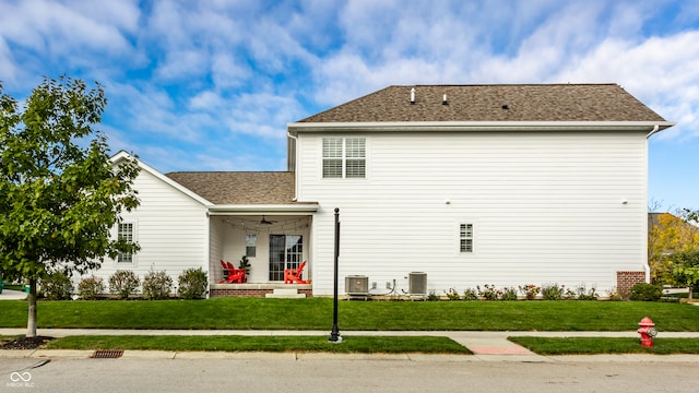 exterior space with a yard and cooling unit