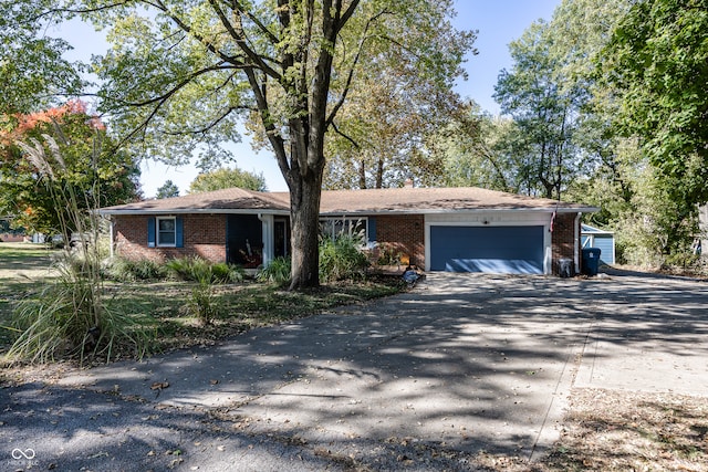 ranch-style home featuring a garage