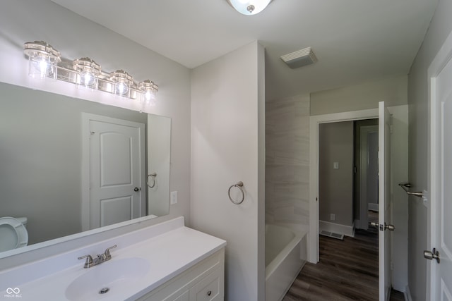 bathroom with vanity and hardwood / wood-style floors