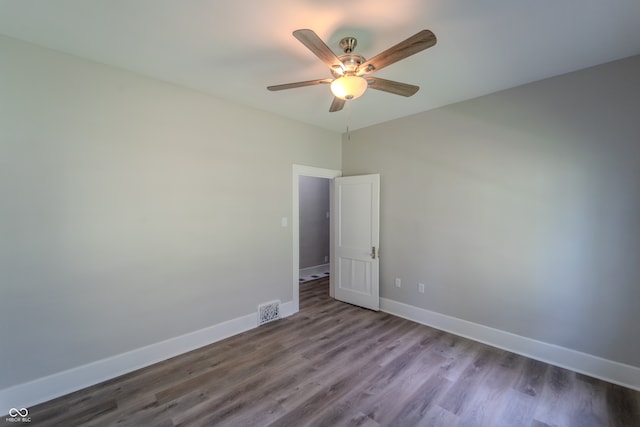 spare room featuring ceiling fan and hardwood / wood-style floors