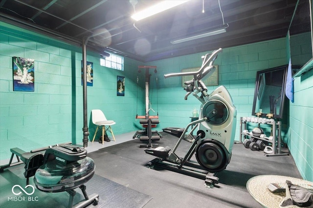 exercise area with concrete block wall