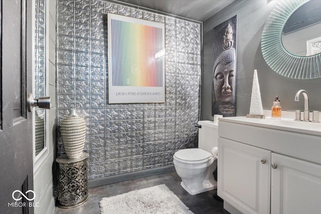 bathroom with toilet and vanity